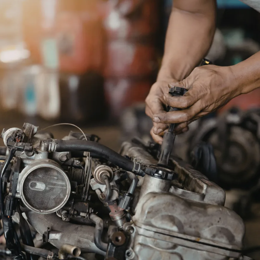 Mechanic working on a powersports engine